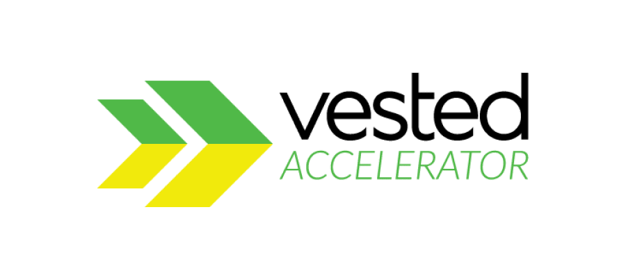 Logo for Vested Accelerator in black and green text with yellow and green graphic elements.
